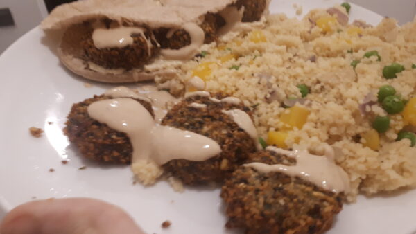 falafel, tahini sauce and pitta with cous cous