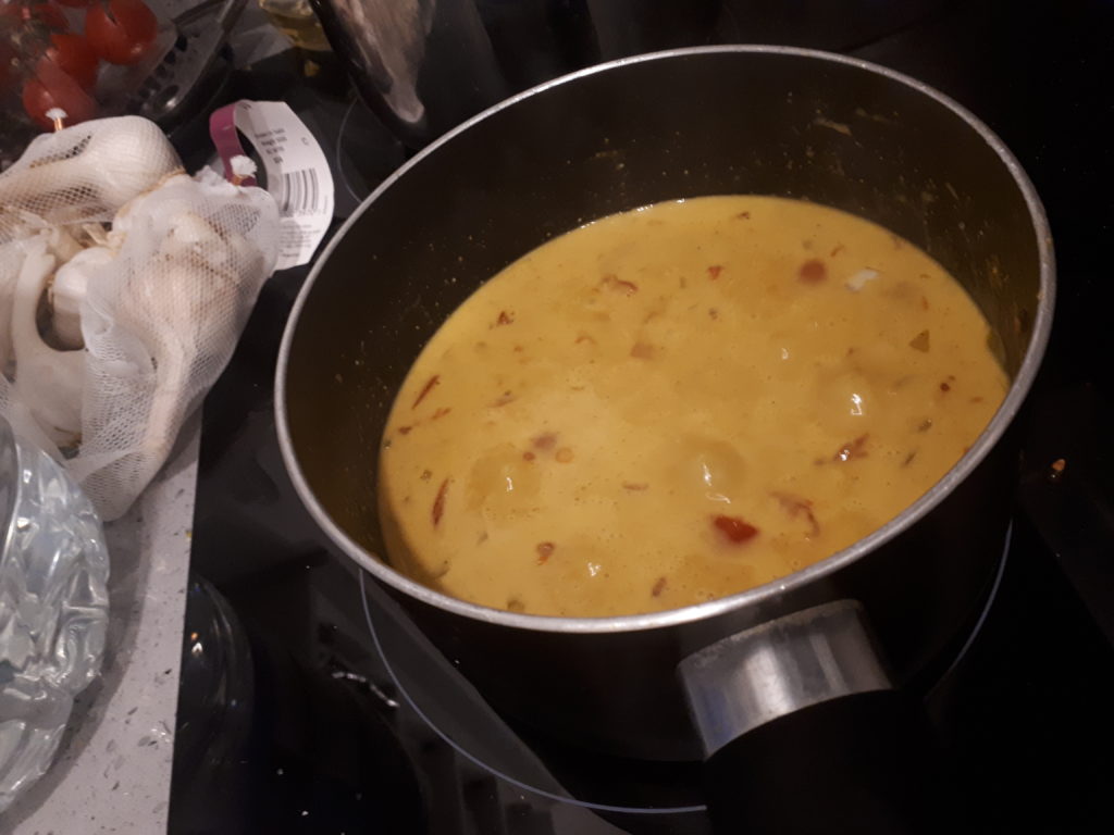 creamy red lentil curry on stove