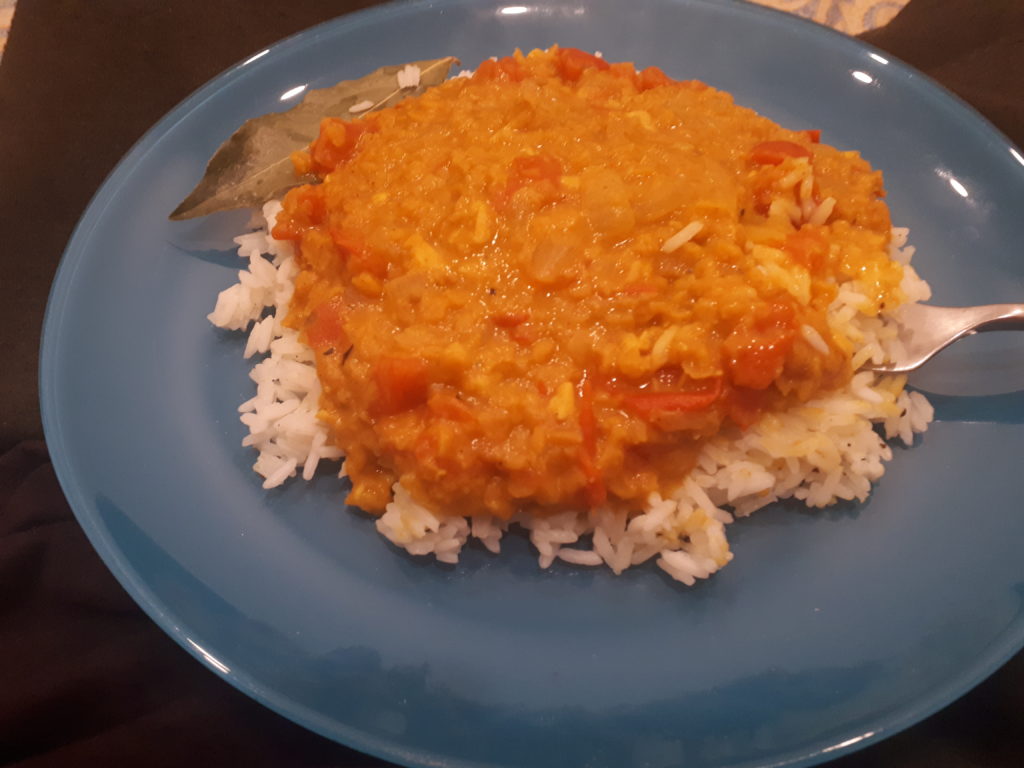 Red lentil curry and white rice with bayleaf