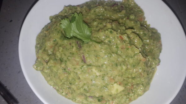 vegan guacamole in white bowl